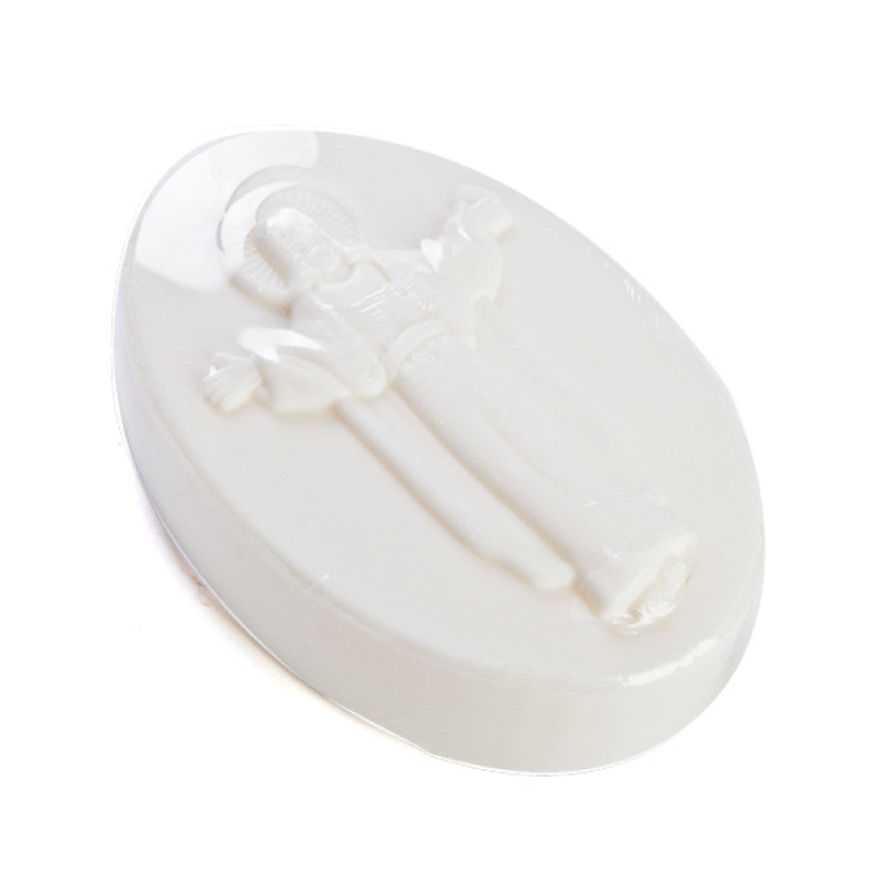 A white oval Jesus Christ novelty soap laying down on a white background