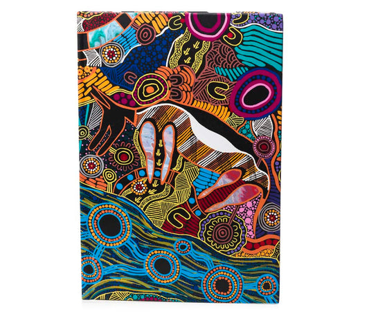 Colorful Aboriginal  design notebook with artistic patterns on a white background