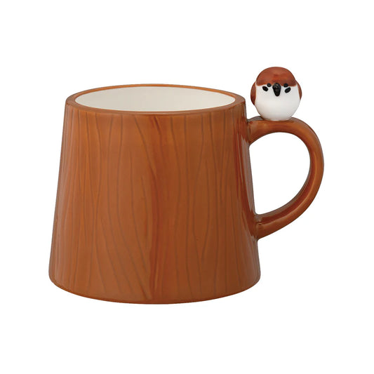 Brown wooden-textured mug with a bird figurine on a white background