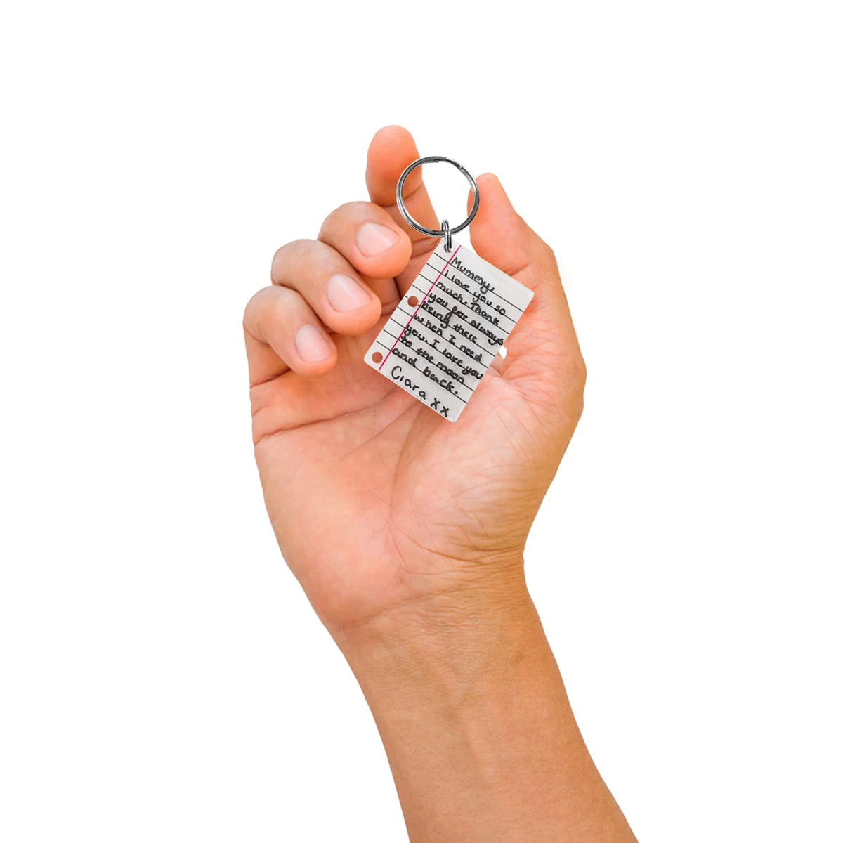 a hand displaying the shrunken letter on a keychain, featuring a white background.