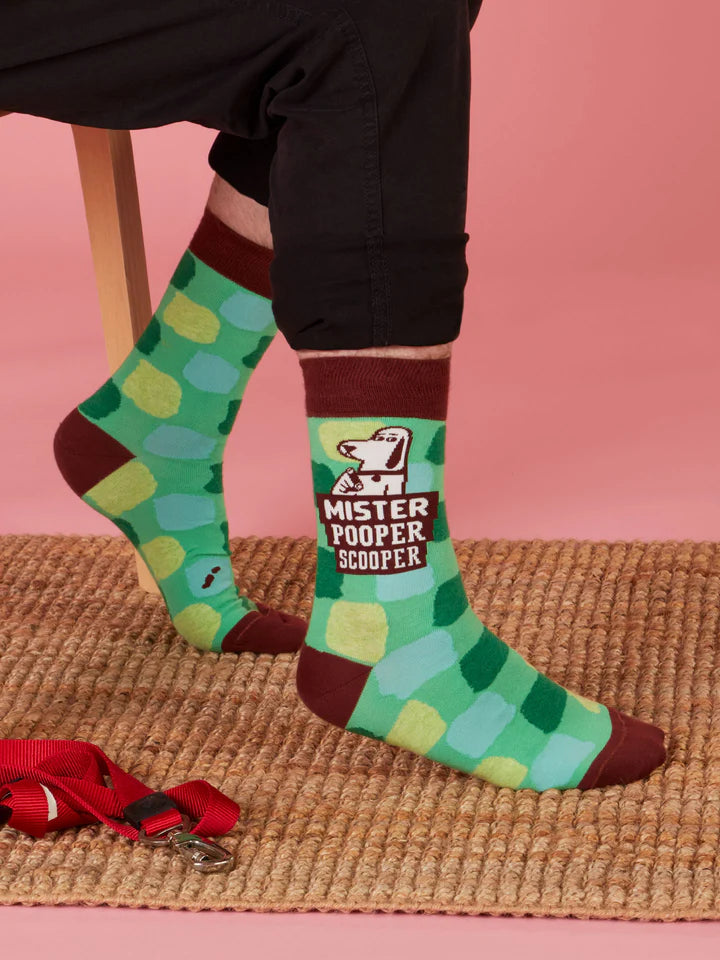 Lifestyle picture of two men's egs wearing Mr.Pooper Scooper men's socks