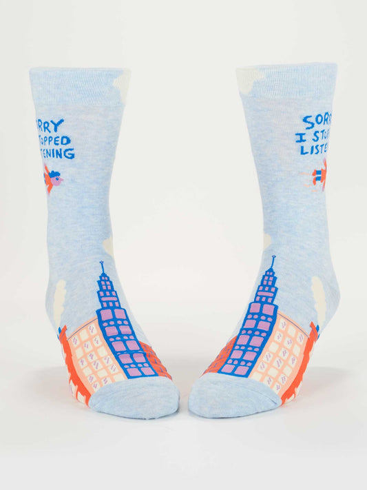Pair of socks with city skyline design and text on a white background