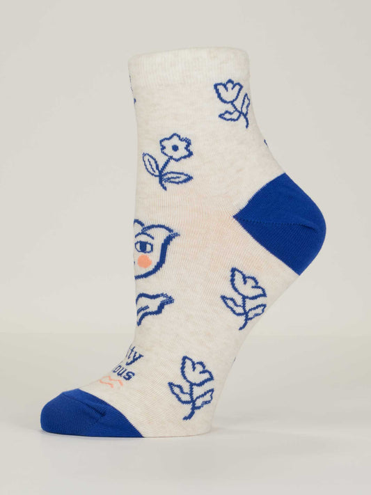 White sock with blue floral patterns on a white background