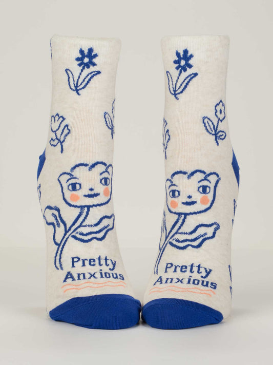 Pair of socks with floral design and 'Pretty Anxious' text on a white background