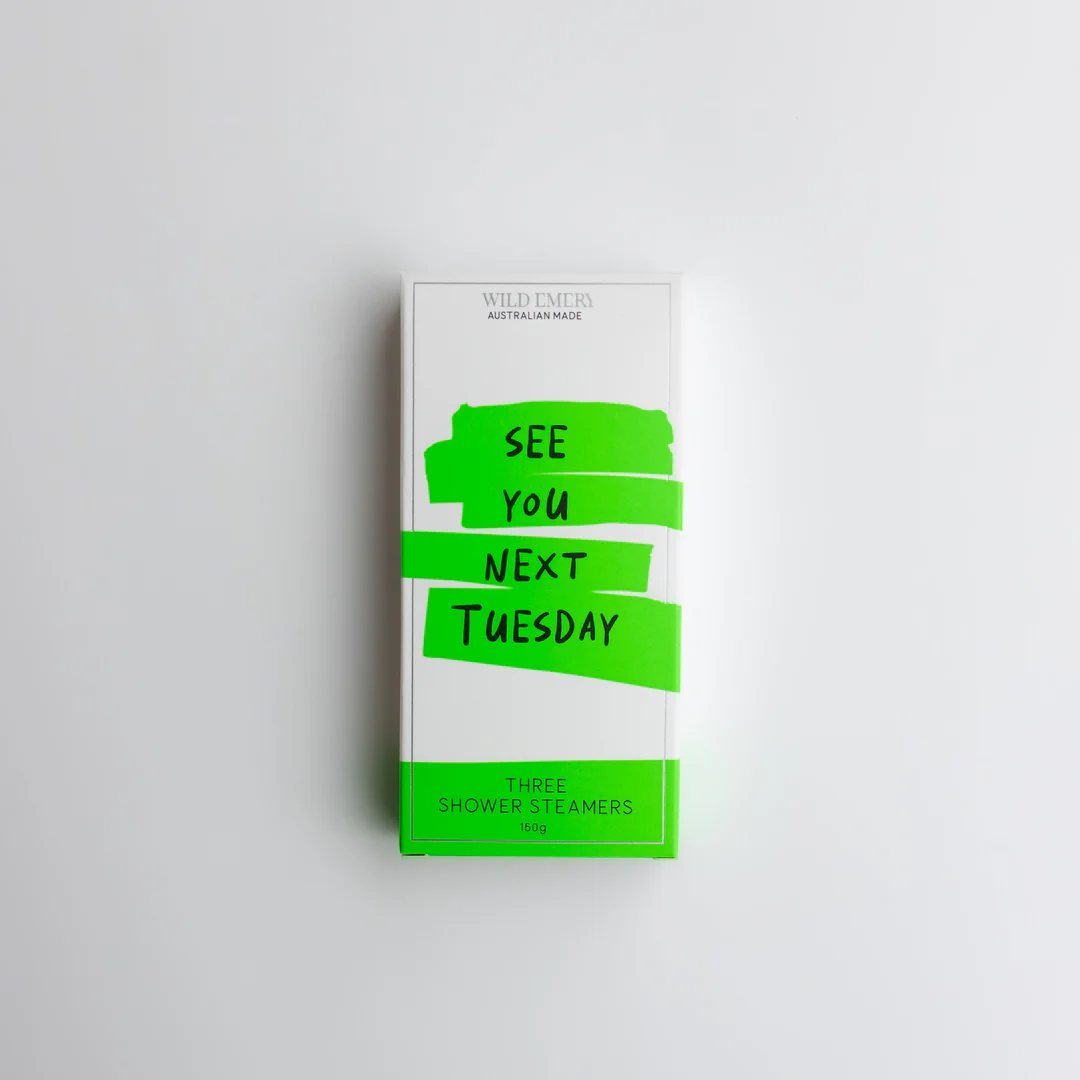 A green box containing a trio of Wild Emery shower steamers. The caption reads: See you next Tuesday.