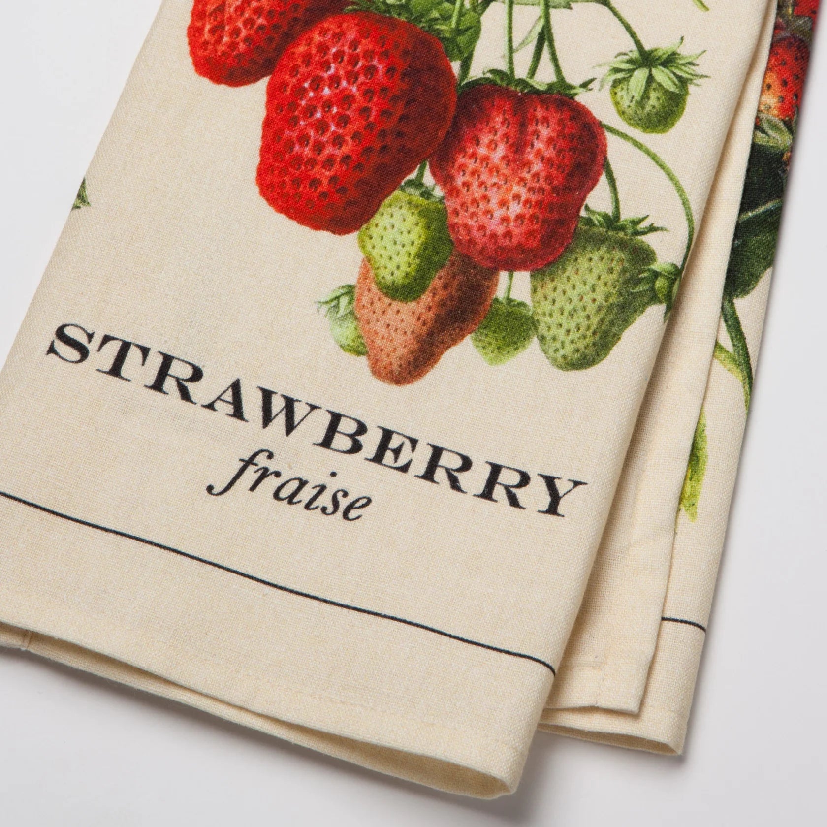 Tea towel with strawberry design and text on a white background
