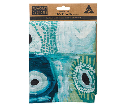 A folded Tea towel on a carded header featuring - Australian indigenous art by May Wokka Chapman