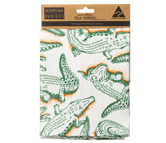 Alperstein Designs folded tea towel with a green and white print of crocodiles on a white background