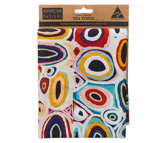 A folded Tea Towel on a cardboard header - Australian indigenous art by Gladys Kuru Bidu on a white background|Gizmo Gifts