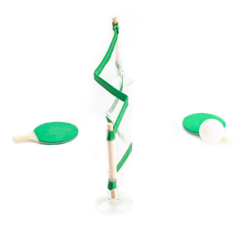 Green toy sailboat with a clear sail on a white background