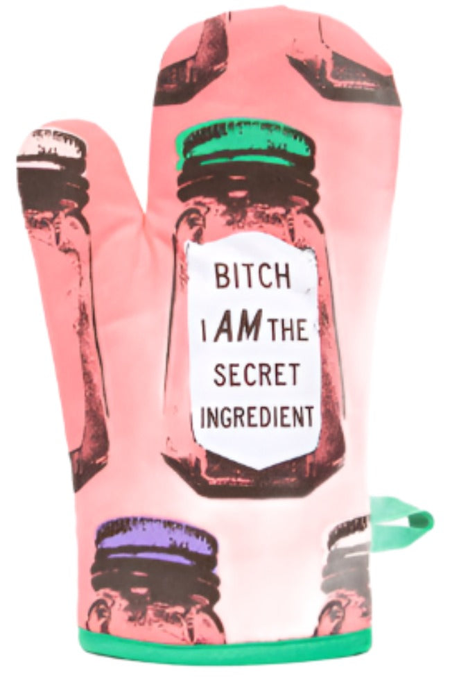 A pink BLUEQ Oven glove with images of salt shakers and the text inside that reads: Bitch I am the secret ingredient. The background is white.