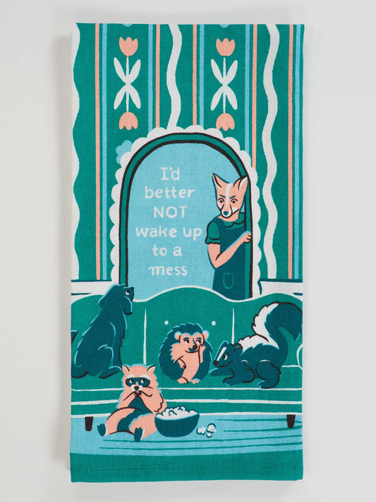 Tea towel with cartoon fox and raccoons design and text 'I'd better NOT wake up to a mess'.