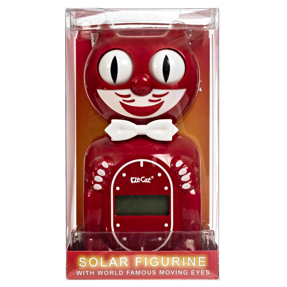 Red solar figurine with moving eyes in packaging on a white background