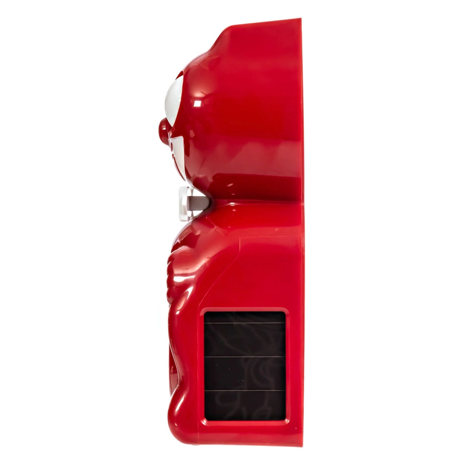 Red alarm clock side view on a white background