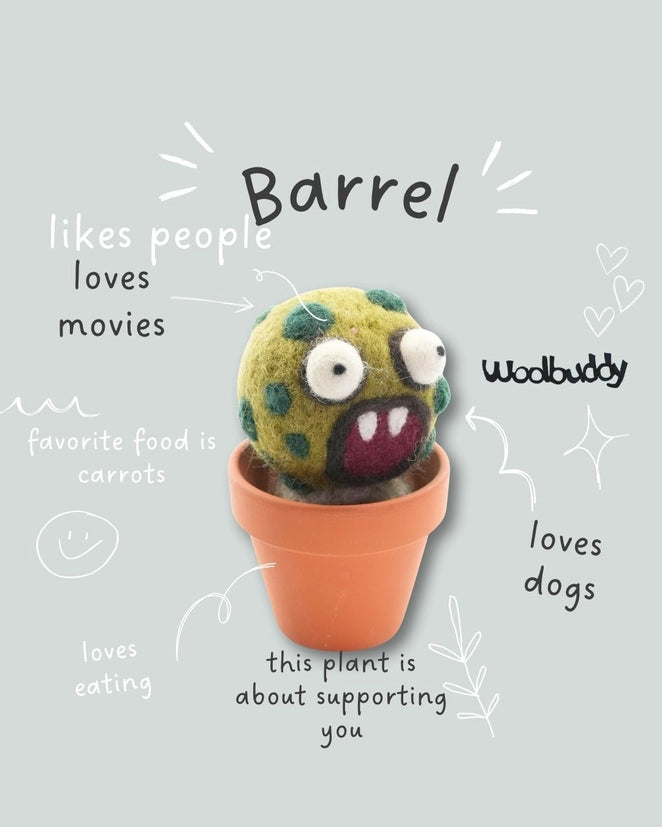 A Wool felt barrel cactus decoration placed in the centre of a grey background. The words around the "Barrel" describe its characteristics.