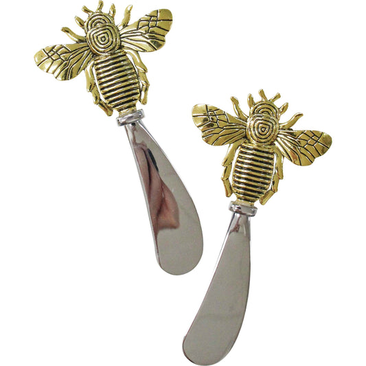 Two bee-shaped butter spreaders on a white background
