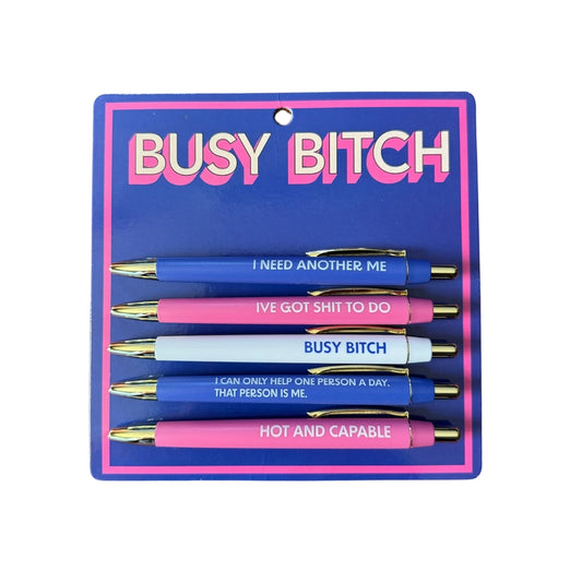 Set of pens with humorous text on a blue card labeled 'BUSY BITCH'.
