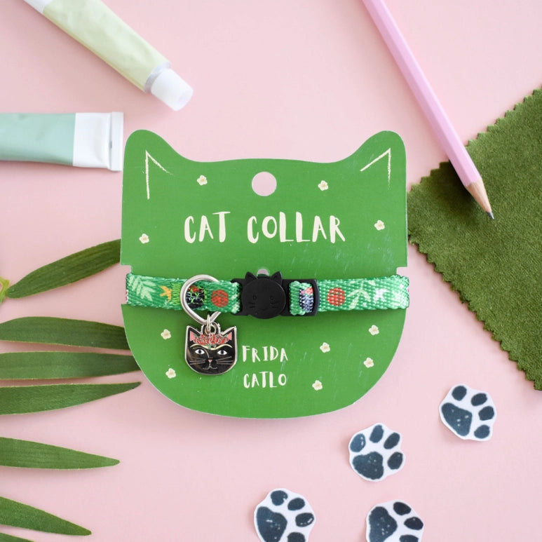 Cat collar with a green label on a pink background with green leaves and paw prints.