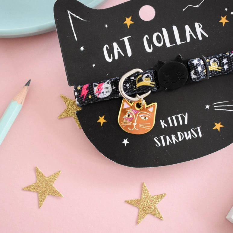 Cat collar with 'Kitty Stardust' charm on a pink background with stars