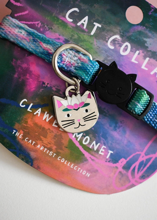 Cat collar with decorative charm on a colorful packaging background