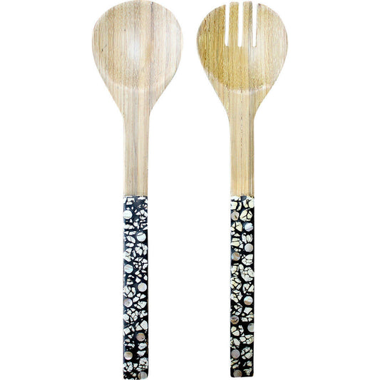 Two wooden utensils with black and white patterned handles on a white background