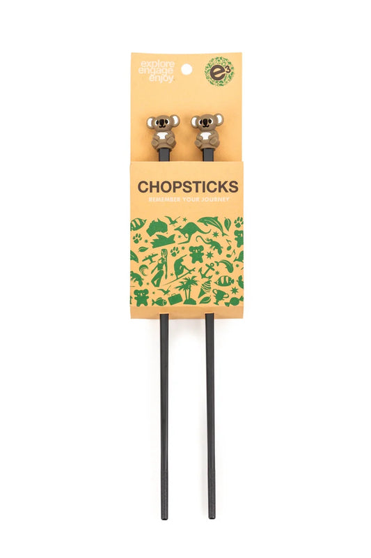 Pair of chopsticks with a branded packaging sleeve on a white background