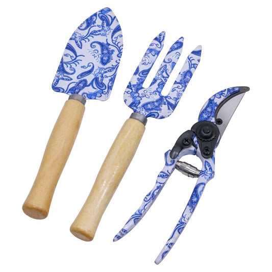 Gardening tools with blue and white patterned handles on a white background