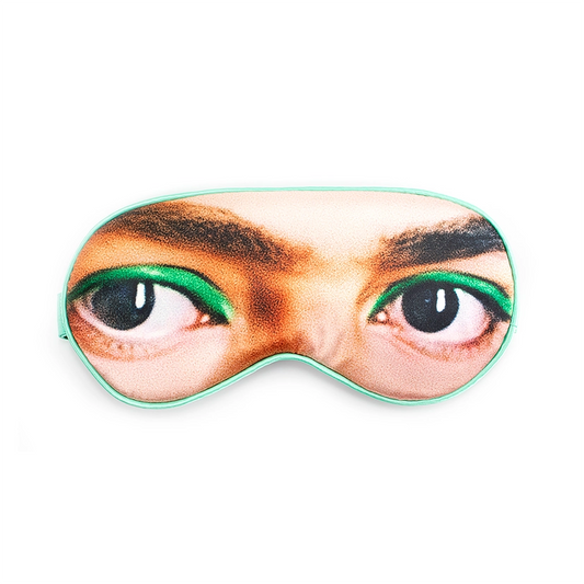 A sleep mask featuring the eyes and eyebrows of Frida Kahlo on a white background.