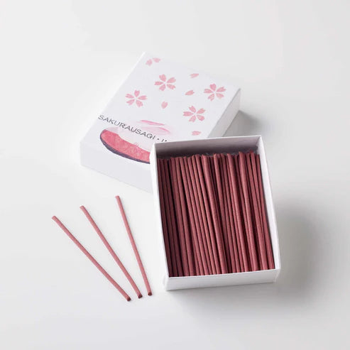 Incense sticks in an open box with 'Sakurausagi' branding on a white background