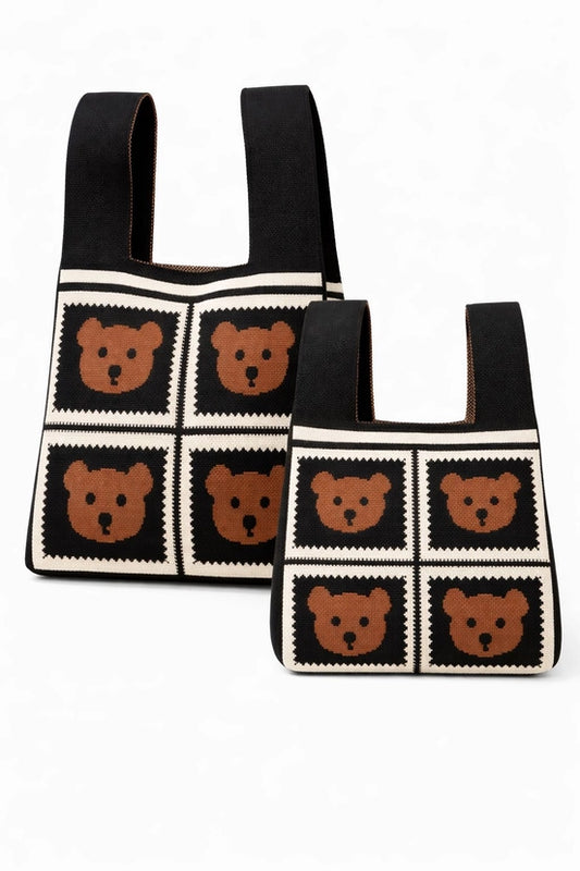 Two black bags with bear pattern on a white background