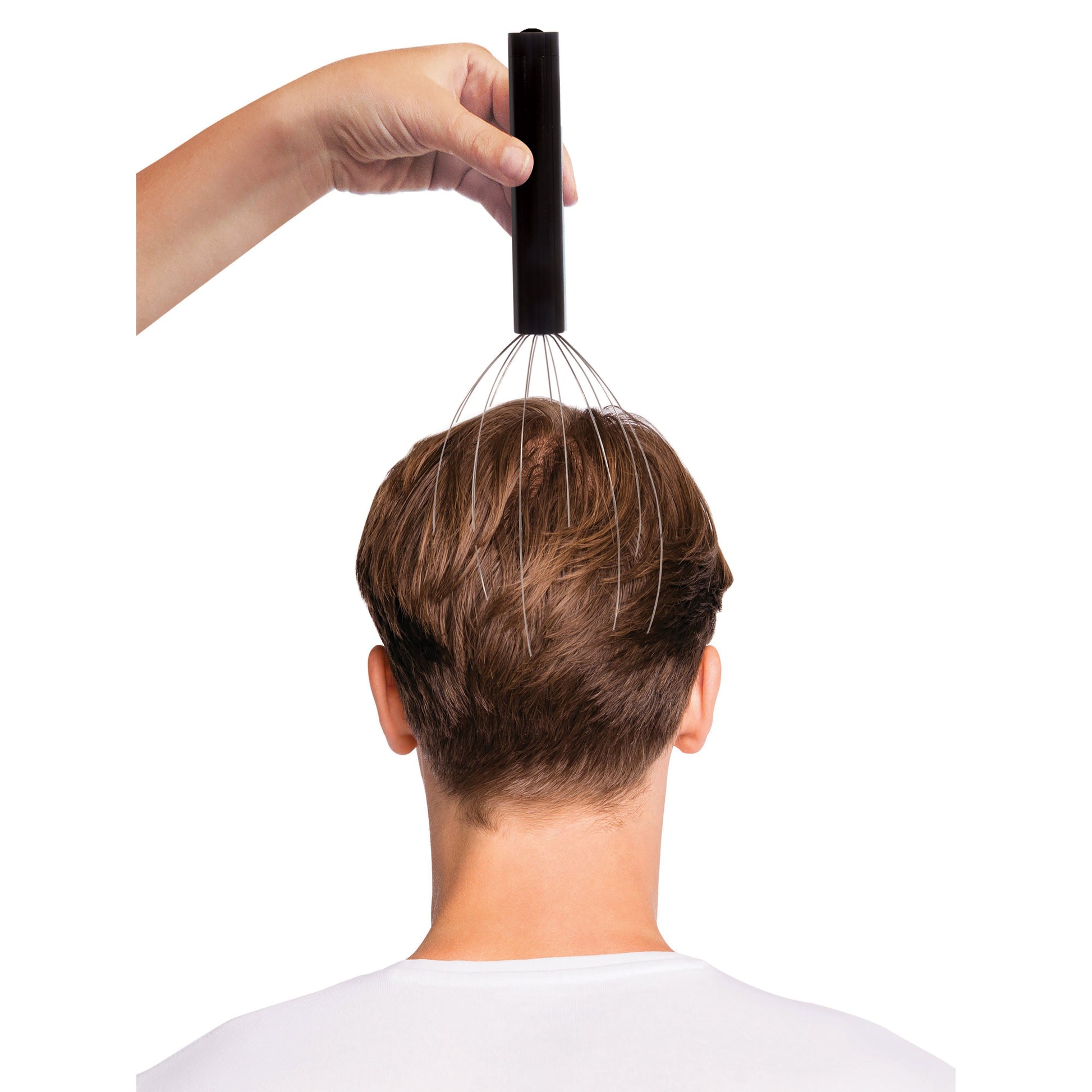 Person using a scalp massager on their head against a white background