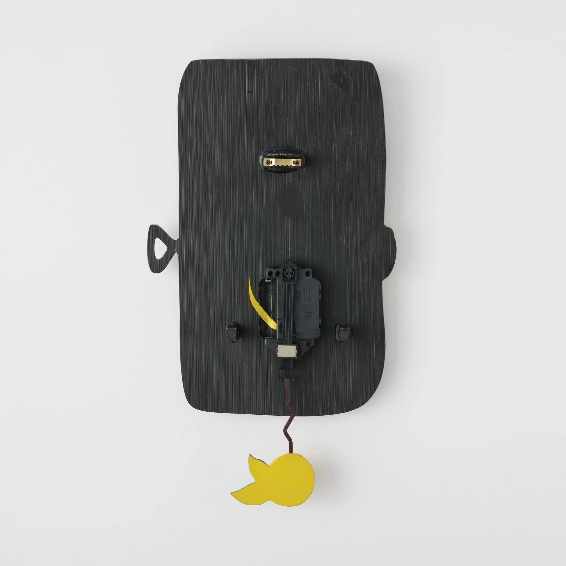 Back view wall clock with a yellow accent on a white background