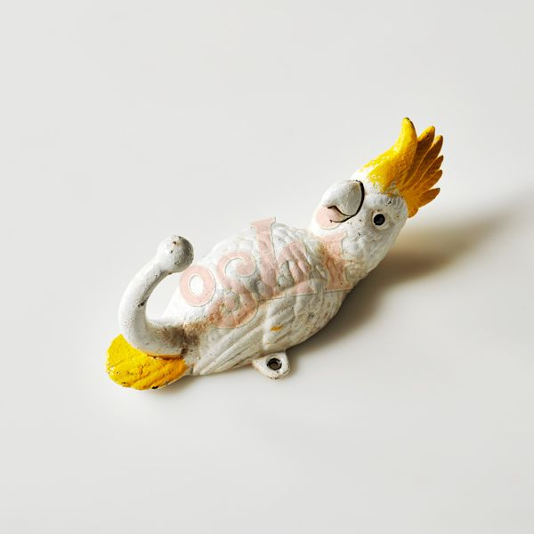 Cast iron parrot wall hook with yellow crest on a white background