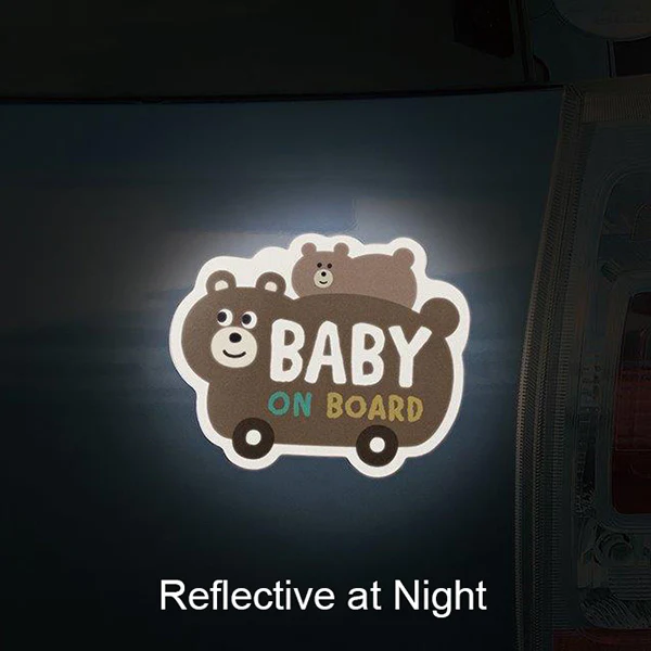 Reflective 'Baby on Board' sticker with cartoon bears on a dark background