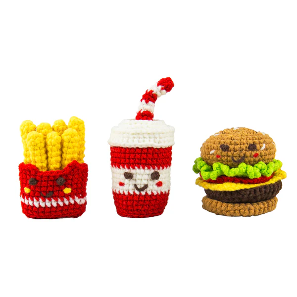 Crocheted toys resembling French fries, a drink, and a hamburger on a white background