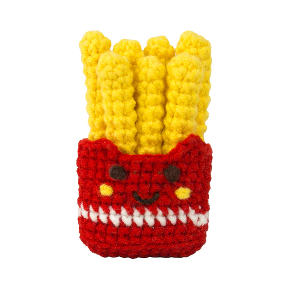 Crocheted toy resembling a bag of fries with a face on a white background