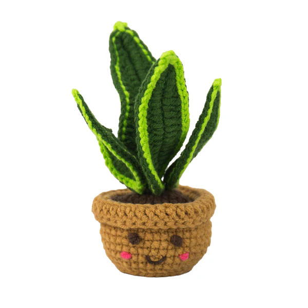 Crocheted potted plant with a smiling face on a white background