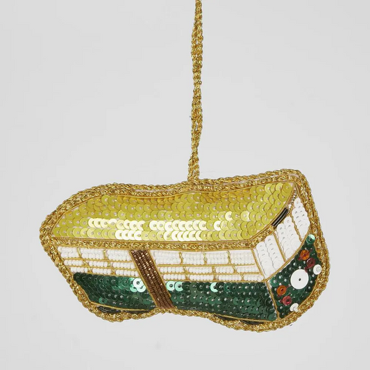 Decorative Melbourne tram tree decoration with sequins and beads on a light gray background