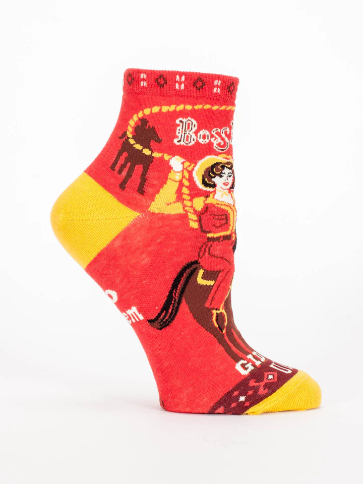 Red and yellow sock with graphic design on a white background