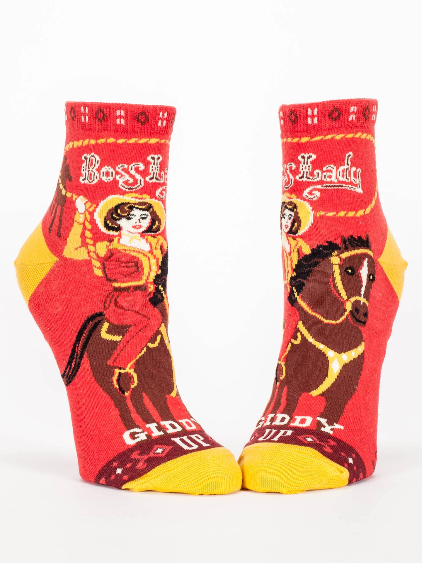 Red socks with a horse and rider design on a white background
