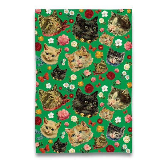 Tea towel with cat and flower pattern on a green background