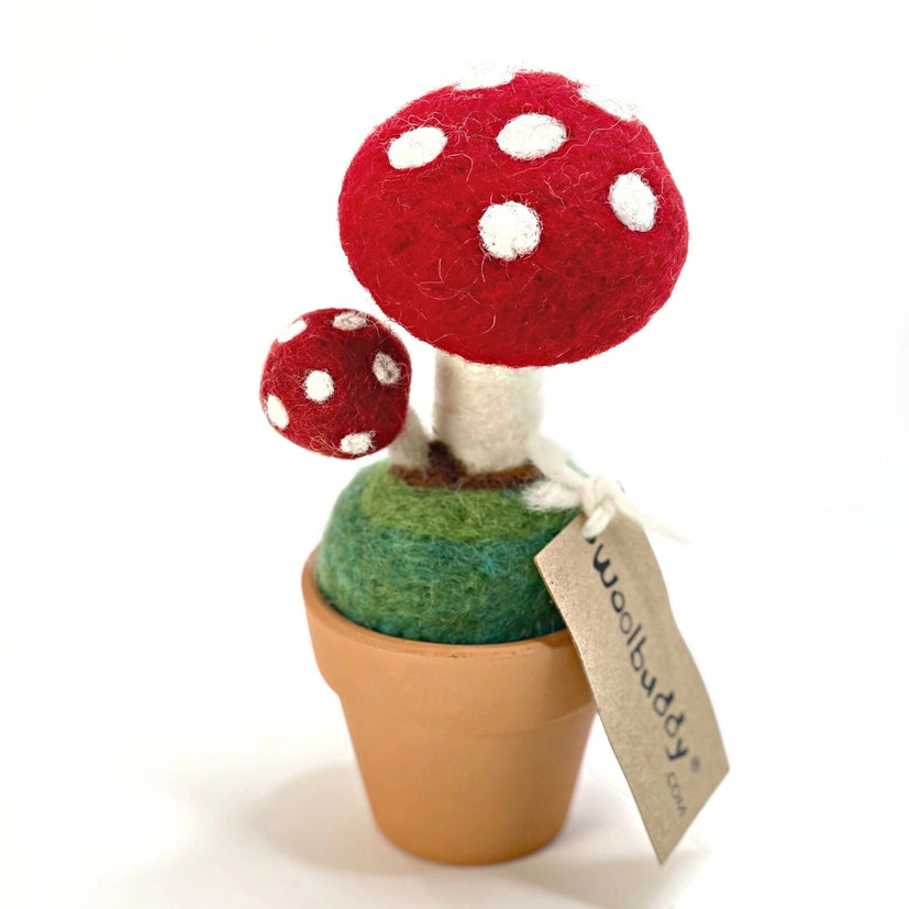 The back view of the Wool felt mushroom potted plant on a white background.