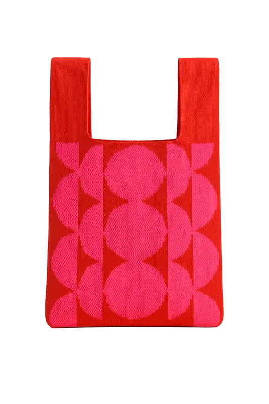 Red reusable shopping bag with pink geometric pattern on a white background