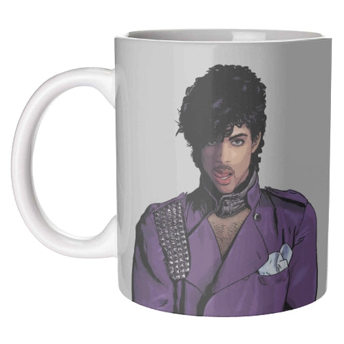 A white ceramic mug featuring a printed graphic of the musician Prince in a purple jacket, shown against a plain white background.