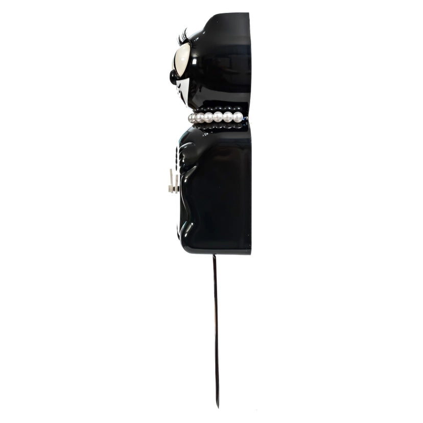 Black vintage-style clock with pearl accents on a white background