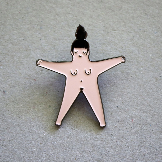 Pin with a stylized pink women's figure on a textured surface