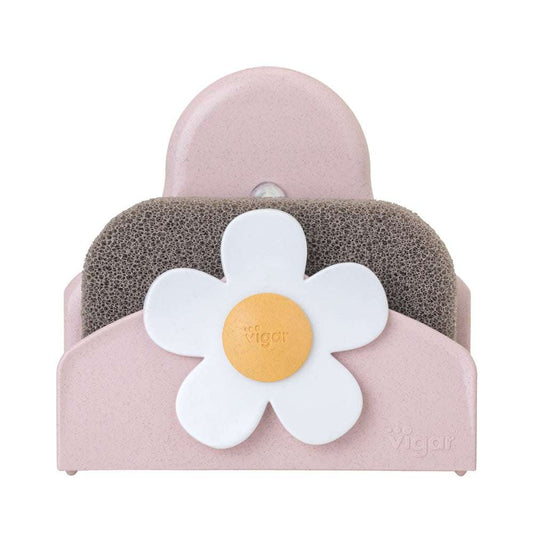 Pink sponge holder with a white flower design on a white background