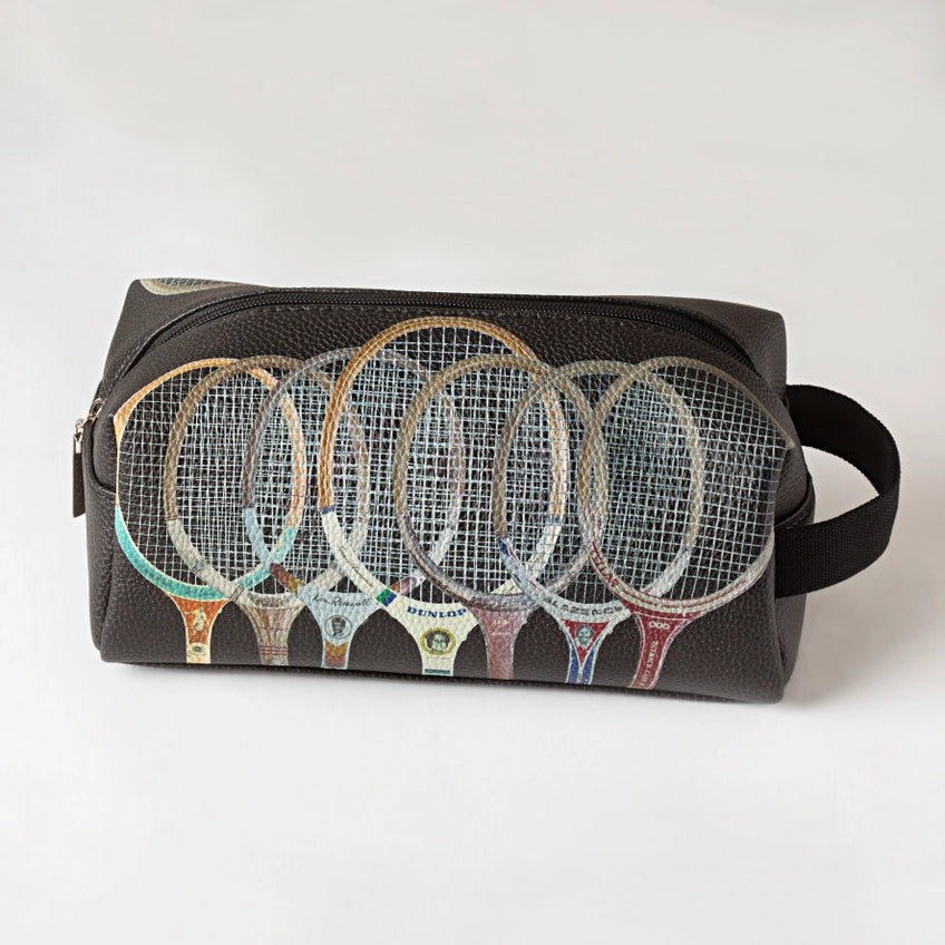Black toiletry bag with colorful tennis racket designs on a white background