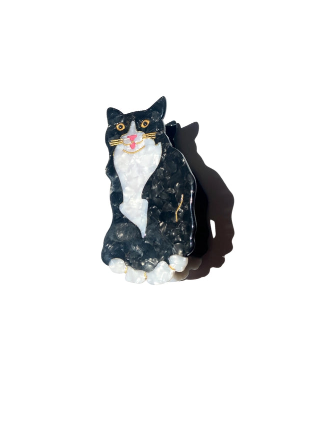 Black and white cat hair claw on a white background