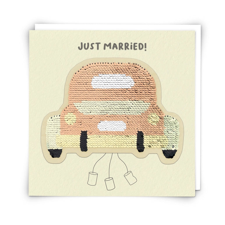 Card with a sequin-covered car illustration and 'Just Married!' text on a beige background